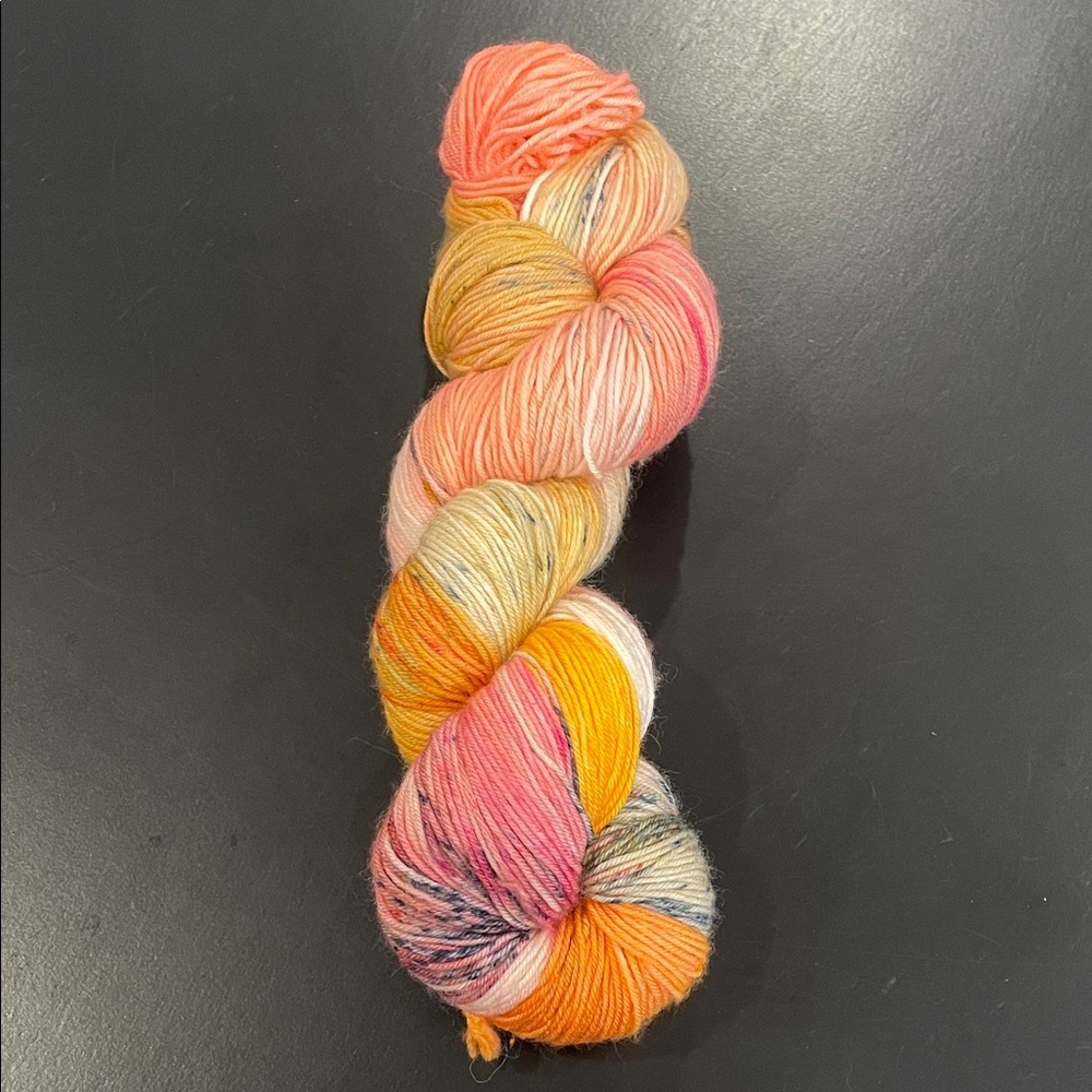 New yarn skein of hand dyed sock wool approximately 400 yards